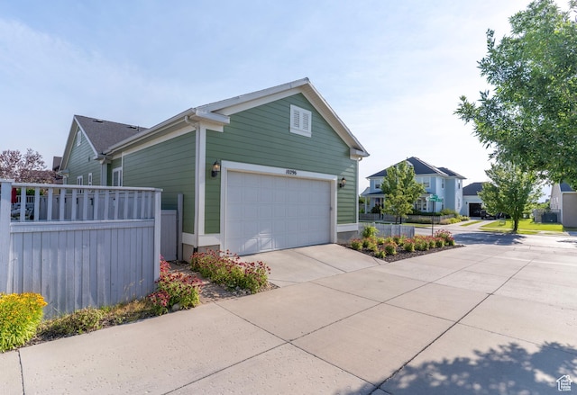 10296 S Salmon Dr, South Jordan, UT 84095 - view of property exterior with concrete driveway and a garage