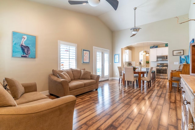 10296 S Salmon Dr, South Jordan, UT 84095 - living area with arched walkways, high vaulted ceiling, ceiling fan, and wood finished floors