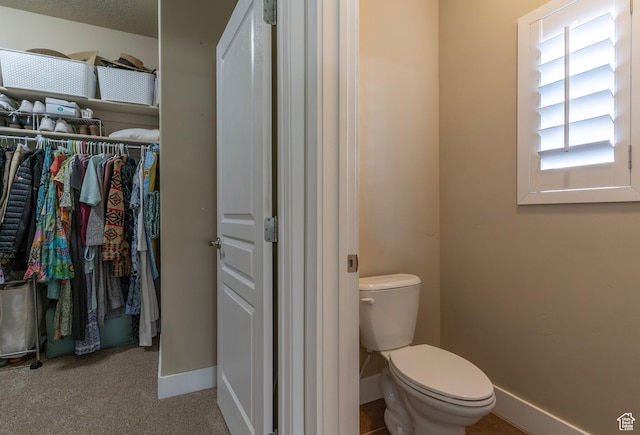 10296 S Salmon Dr, South Jordan, UT 84095 - bathroom featuring baseboards and a spacious closet