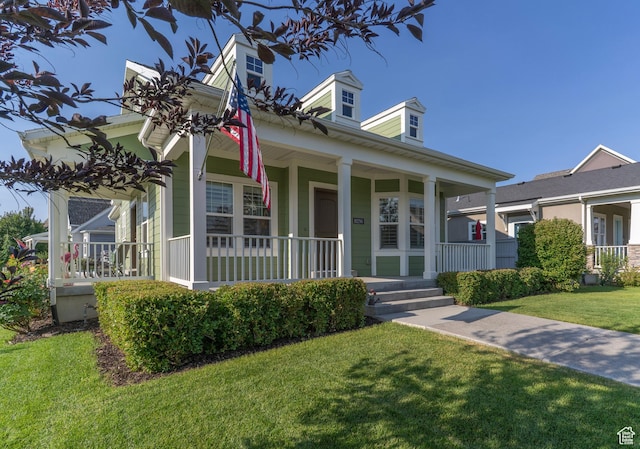 10296 S Salmon Dr, South Jordan, UT 84095 - view of front facade with covered porch and a front yard