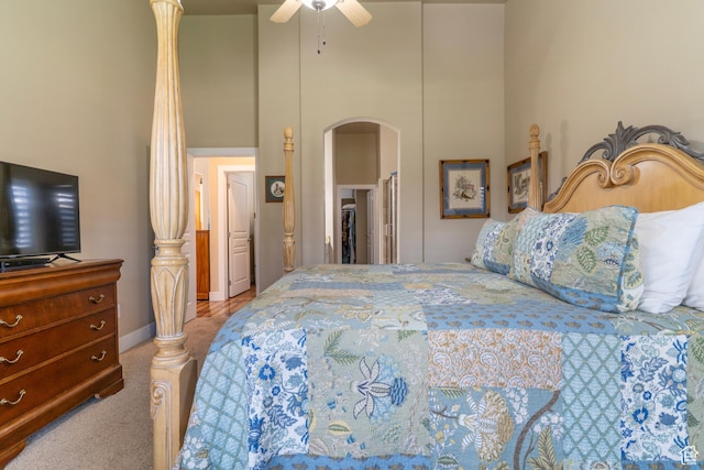 10296 S Salmon Dr, South Jordan, UT 84095 - bedroom with a towering ceiling, arched walkways, carpet flooring, and ceiling fan