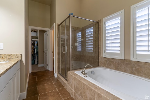 10296 S Salmon Dr, South Jordan, UT 84095 - bathroom featuring a stall shower, a garden tub, vanity, a spacious closet, and tile patterned flooring