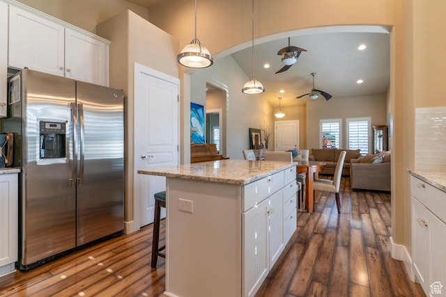 10296 S Salmon Dr, South Jordan, UT 84095 - kitchen featuring stainless steel fridge with ice dispenser, arched walkways, ceiling fan, dark wood-type flooring, and recessed lighting