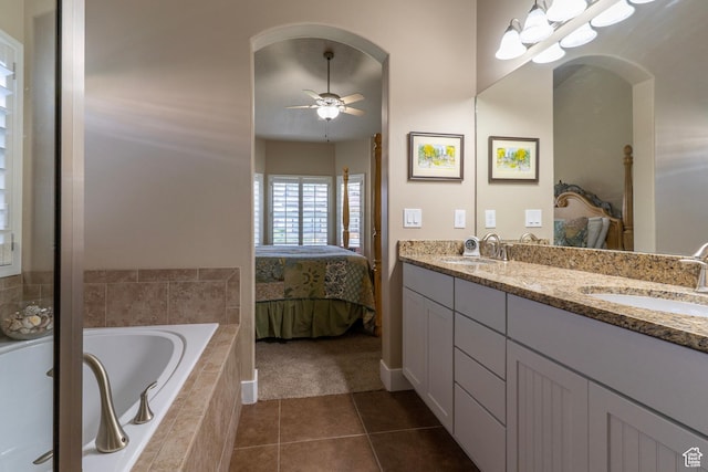 10296 S Salmon Dr, South Jordan, UT 84095 - bathroom with ensuite bathroom, double vanity, a garden tub, tile patterned floors, and a ceiling fan