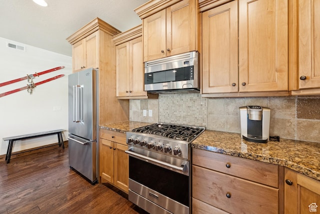 9855 Vista Dr Unit 103, Heber City, UT 84032 - kitchen featuring high end appliances, dark wood finished floors, backsplash, and dark stone countertops