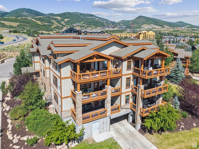 9855 Vista Dr Unit 103, Heber City, UT 84032 - view of property featuring a mountain view, concrete driveway, and an attached garage