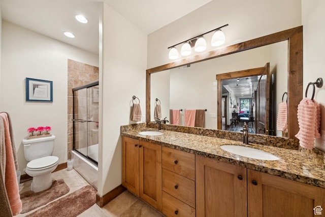 9855 Vista Dr Unit 103, Heber City, UT 84032 - full bathroom featuring double vanity and shower / bath combination with glass door