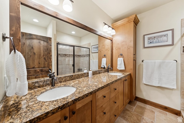 9855 Vista Dr Unit 103, Heber City, UT 84032 - bathroom with double vanity, a stall shower, and stone tile floors