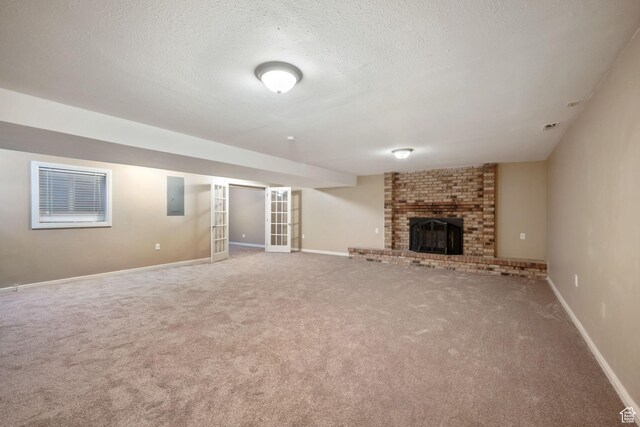 8916 S Cobble Crest Ln E, Sandy, UT 84093 - unfurnished living room with electric panel, carpet flooring, a fireplace, and a textured ceiling