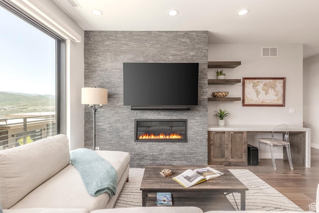855 E Klaim Dr, Hideout, UT 84036 - living area with wood finished floors, recessed lighting, and a fireplace