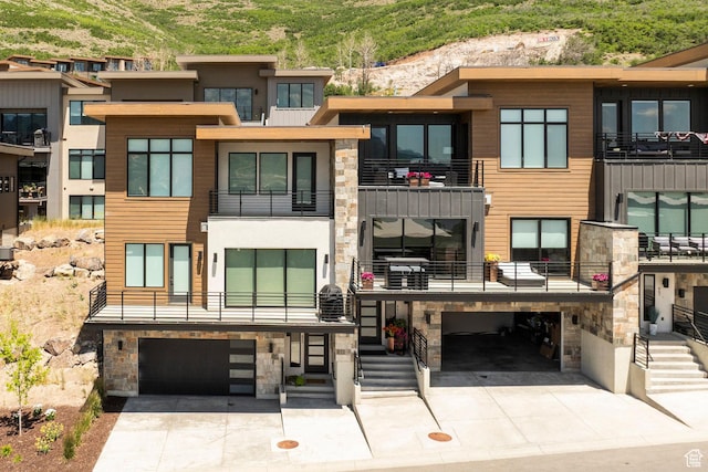 855 E Klaim Dr, Hideout, UT 84036 - view of building exterior featuring a garage and driveway