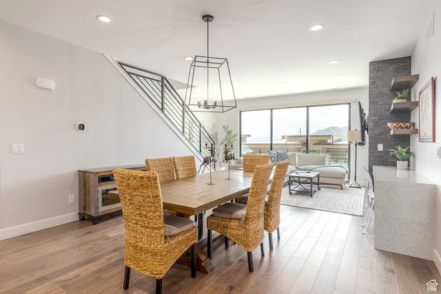 855 E Klaim Dr, Hideout, UT 84036 - dining space with stairway, a chandelier, wood finished floors, and recessed lighting