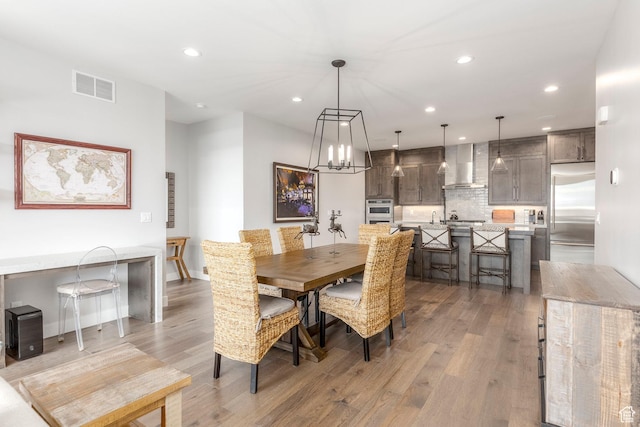 855 E Klaim Dr, Hideout, UT 84036 - dining room featuring recessed lighting, light wood-type flooring, and a chandelier