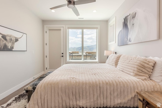 855 E Klaim Dr, Hideout, UT 84036 - bedroom with wood finished floors, recessed lighting, ceiling fan, and a mountain view