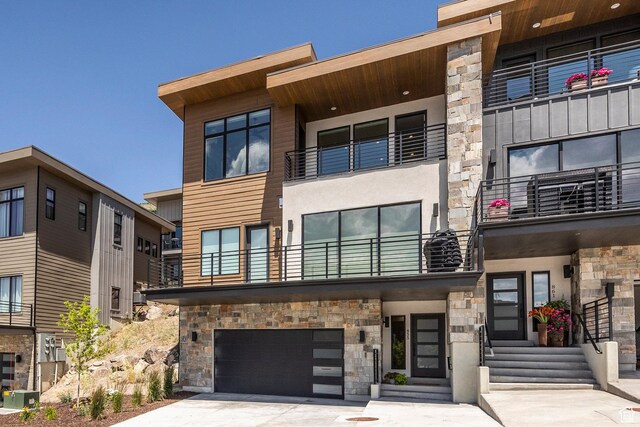 855 E Klaim Dr, Hideout, UT 84036 - view of property with an attached garage, concrete driveway, and entry steps