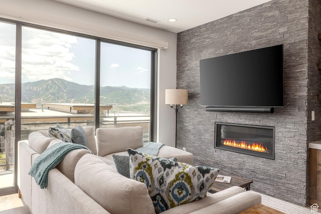 855 E Klaim Dr, Hideout, UT 84036 - living area featuring a large fireplace and wood finished floors
