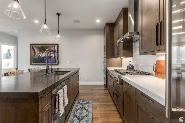 855 E Klaim Dr, Hideout, UT 84036 - kitchen featuring wall chimney exhaust hood, appliances with stainless steel finishes, tasteful backsplash, dark brown cabinets, and dark wood finished floors
