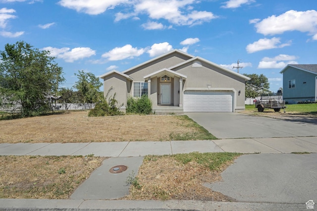 3641 S Country W Dr W, Magna, UT 84044 - ranch-style home featuring a garage, concrete driveway, and stucco siding