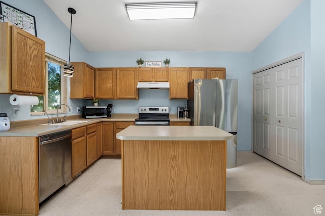 3641 S Country W Dr W, Magna, UT 84044 - kitchen featuring appliances with stainless steel finishes, under cabinet range hood, light countertops, pendant lighting, and a kitchen island