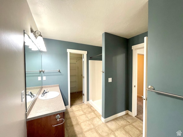 3794 W Angelica Ct, South Jordan, UT 84095 - full bath featuring vanity, a textured ceiling, and a shower