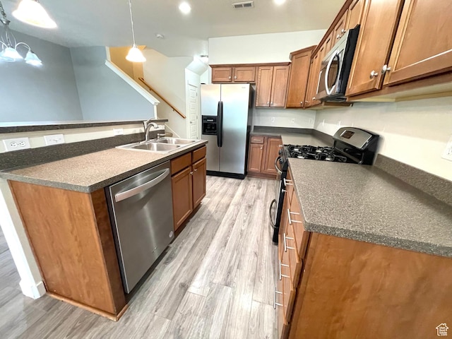 3794 W Angelica Ct, South Jordan, UT 84095 - kitchen with stainless steel appliances, dark countertops, and brown cabinetry