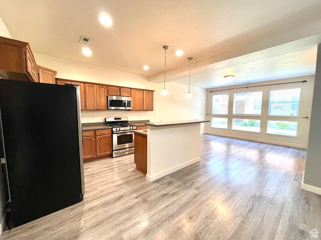 3794 W Angelica Ct, South Jordan, UT 84095 - kitchen with appliances with stainless steel finishes, light wood-style floors, open floor plan, brown cabinets, and pendant lighting
