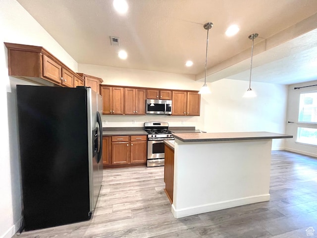 3794 W Angelica Ct, South Jordan, UT 84095 - kitchen with appliances with stainless steel finishes, brown cabinetry, light wood finished floors, hanging light fixtures, and recessed lighting