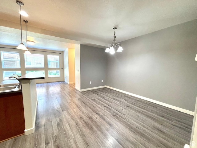 3794 W Angelica Ct, South Jordan, UT 84095 - unfurnished dining area featuring wood finished floors and a chandelier