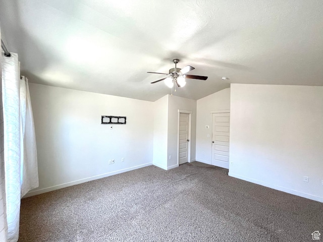 3794 W Angelica Ct, South Jordan, UT 84095 - unfurnished bedroom featuring dark carpet, vaulted ceiling, and ceiling fan