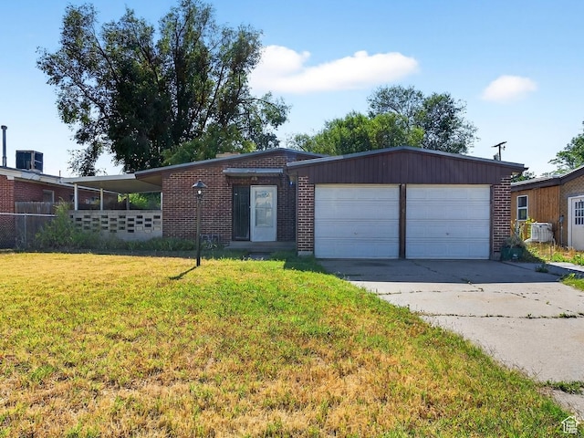 945 N 1200 W, Salt Lake City, UT 84116 - ranch-style house with concrete driveway, an attached garage, a front yard, and brick siding