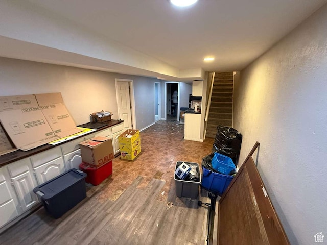 1012 W 3550 N, Pleasant View, UT 84414 - finished basement with dark wood finished floors, stairs, and a textured wall