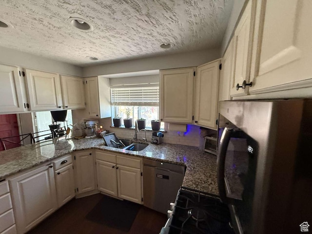 1012 W 3550 N, Pleasant View, UT 84414 - kitchen featuring dishwasher, backsplash, light stone countertops, white cabinetry, and a textured ceiling
