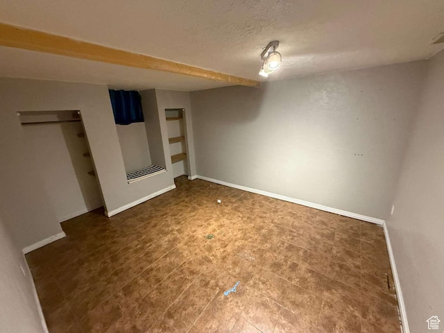 1012 W 3550 N, Pleasant View, UT 84414 - unfurnished bedroom featuring baseboards and a textured ceiling