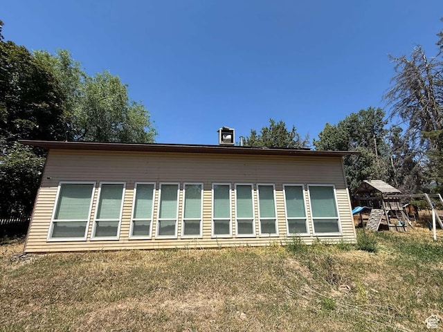 1012 W 3550 N, Pleasant View, UT 84414 - view of side of home with a playground