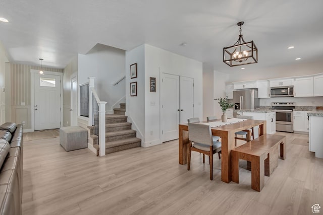4913 E Golden Meadow Xing, Eagle Mountain, UT 84005 - dining room featuring a chandelier, stairway, light wood-type flooring, and recessed lighting