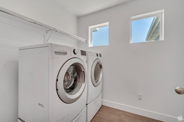 4913 E Golden Meadow Xing, Eagle Mountain, UT 84005 - laundry room with washer and clothes dryer and light wood finished floors