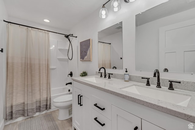 4913 E Golden Meadow Xing, Eagle Mountain, UT 84005 - full bathroom featuring double vanity, shower / tub combo, and wood finished floors