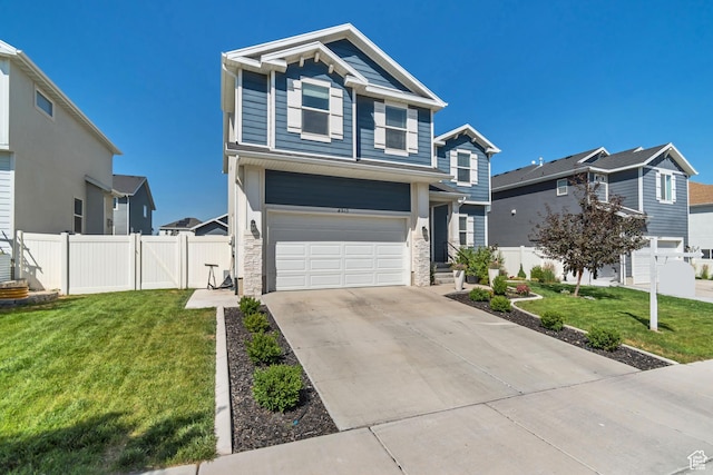 4913 E Golden Meadow Xing, Eagle Mountain, UT 84005 - view of front facade with a garage, driveway, and stone siding