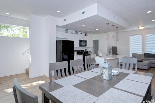 1690 S 225 W, Clearfield, UT 84015 - dining area featuring light wood-style flooring, recessed lighting, and stairs