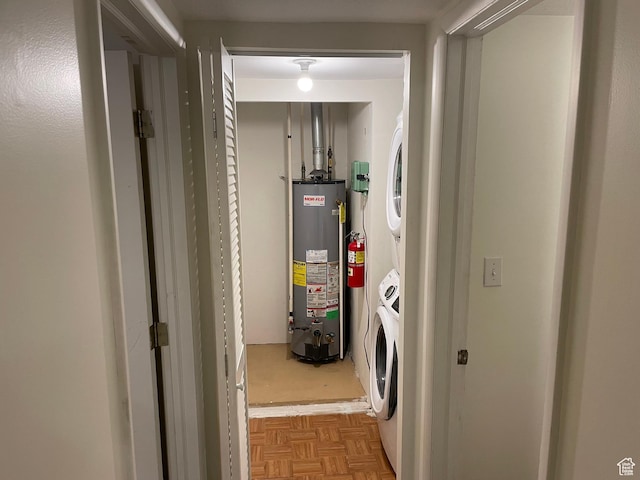 484 N 300 W, Logan, UT 84321 - washroom featuring gas water heater and stacked washer / dryer