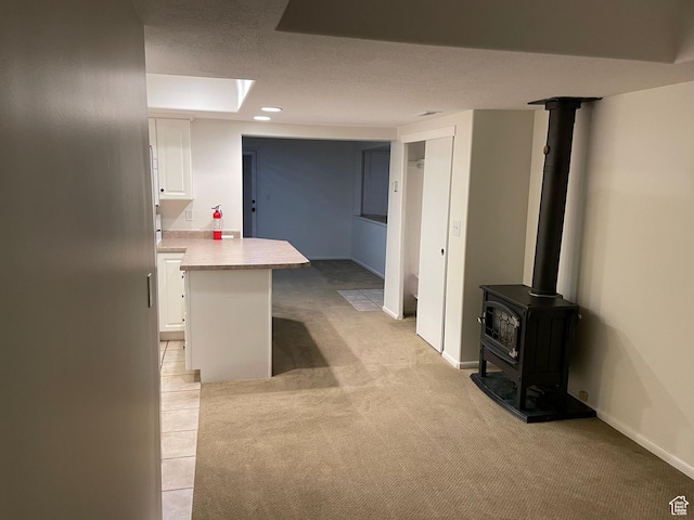484 N 300 W, Logan, UT 84321 - basement featuring light colored carpet and a wood stove