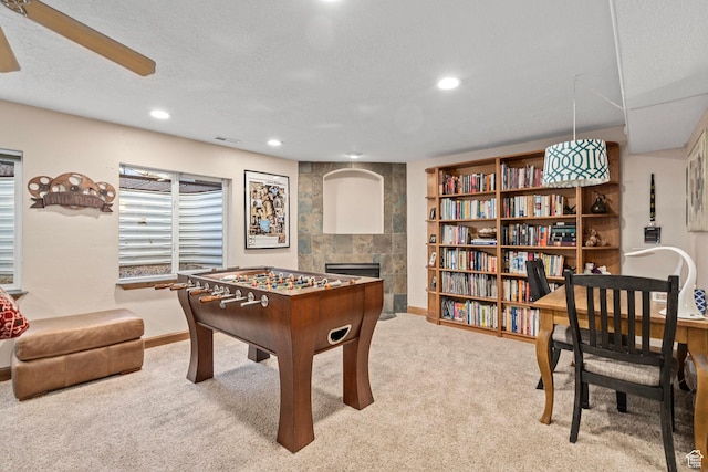 9116 Silver Lake Dr, Cedar Hills, UT 84062 - recreation room featuring a fireplace, carpet floors, recessed lighting, a ceiling fan, and a textured ceiling