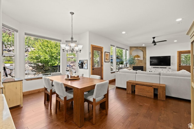 9116 Silver Lake Dr, Cedar Hills, UT 84062 - dining room featuring a chandelier, ceiling fan, dark wood-type flooring, healthy amount of natural light, and recessed lighting