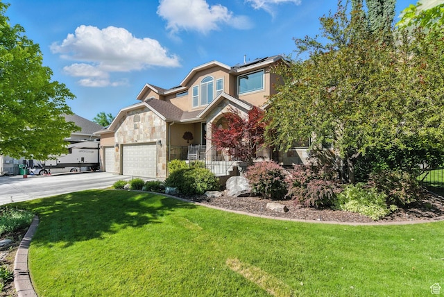 9116 Silver Lake Dr, Cedar Hills, UT 84062 - view of front of home featuring stone siding, concrete driveway, solar panels, a front lawn, and a porch