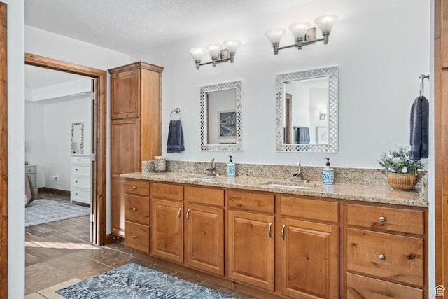 9116 Silver Lake Dr, Cedar Hills, UT 84062 - ensuite bathroom featuring double vanity and a textured ceiling