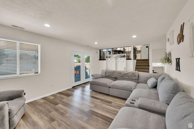 1609 N 2275 W, Clinton, UT 84015 - living room with french doors, light wood-style flooring, recessed lighting, and stairs