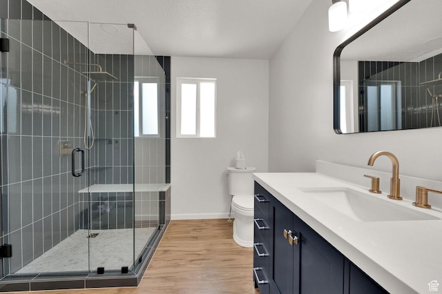 1609 N 2275 W, Clinton, UT 84015 - full bathroom featuring vanity, a stall shower, and wood finished floors
