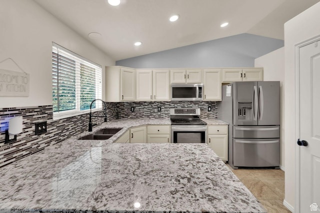 1609 N 2275 W, Clinton, UT 84015 - kitchen with appliances with stainless steel finishes, light stone counters, lofted ceiling, tasteful backsplash, and recessed lighting