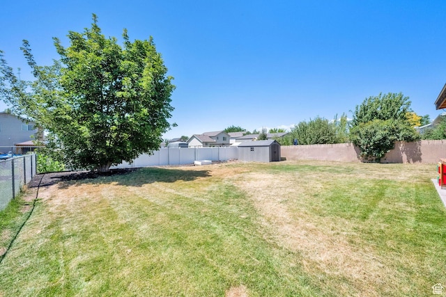 1609 N 2275 W, Clinton, UT 84015 - fenced backyard featuring a storage unit