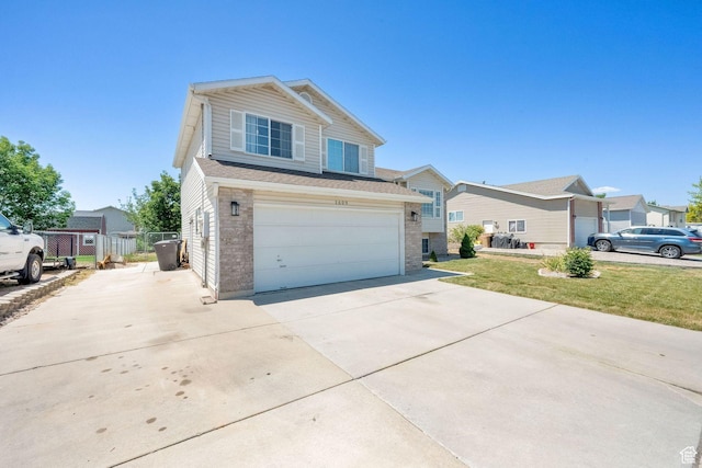 1609 N 2275 W, Clinton, UT 84015 - traditional-style house with concrete driveway, an attached garage, and brick siding